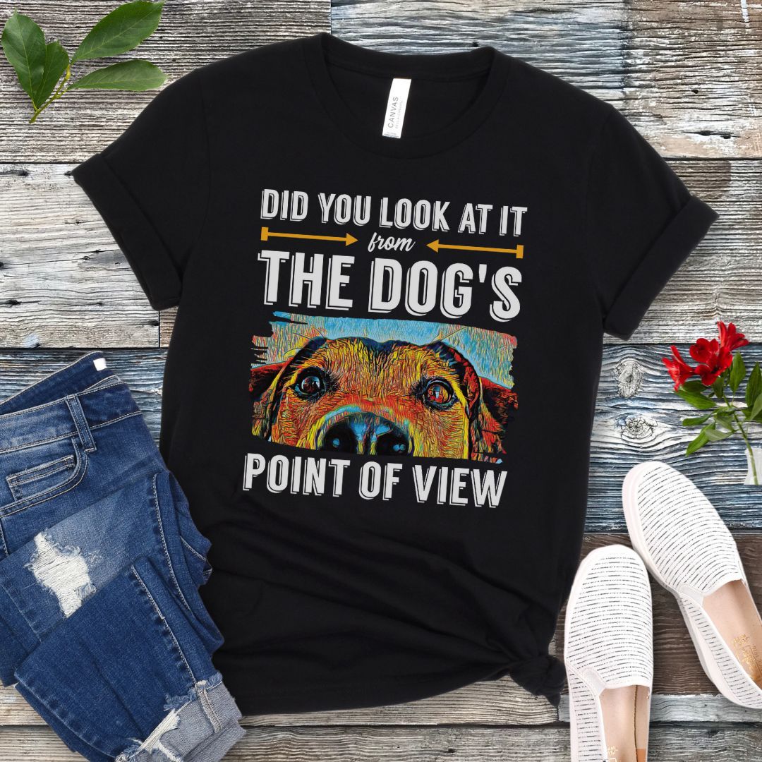 Black dog lover t-shirt with colorful dog face graphic and the text 'Did You Look At It From Your Dog's Point of View', laid flat with jeans and white shoes.