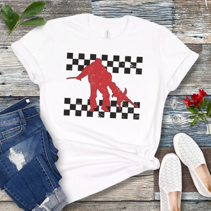 Dark grey Schutzhund t-shirt with bite work dog and checkerboard design, presented on a wooden surface with jeans and shoes.