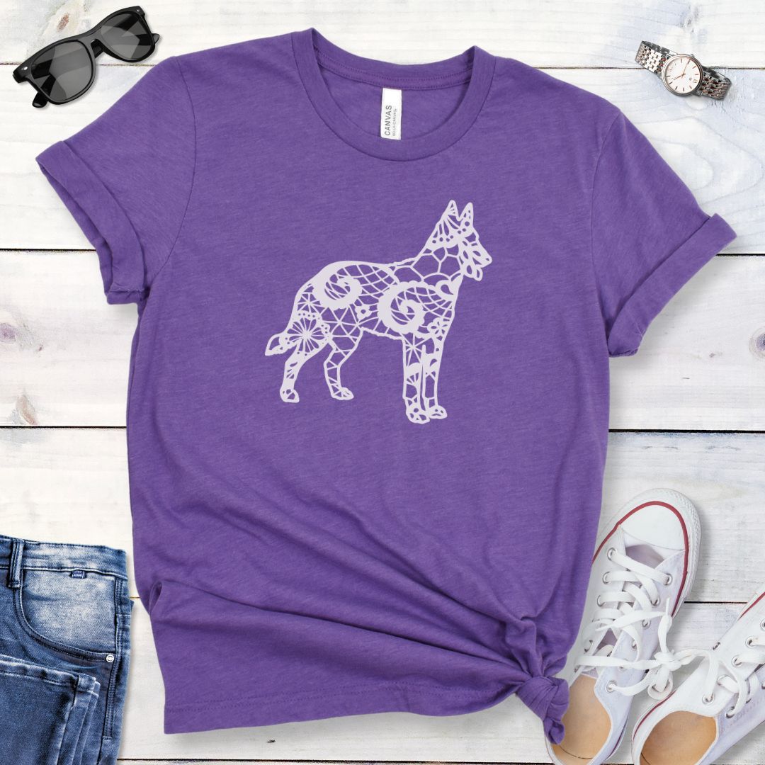 Purple dog mom t-shirt with a faux lace design of a Belgian Malinois dog, presented on a wooden surface with jeans and sneakers.