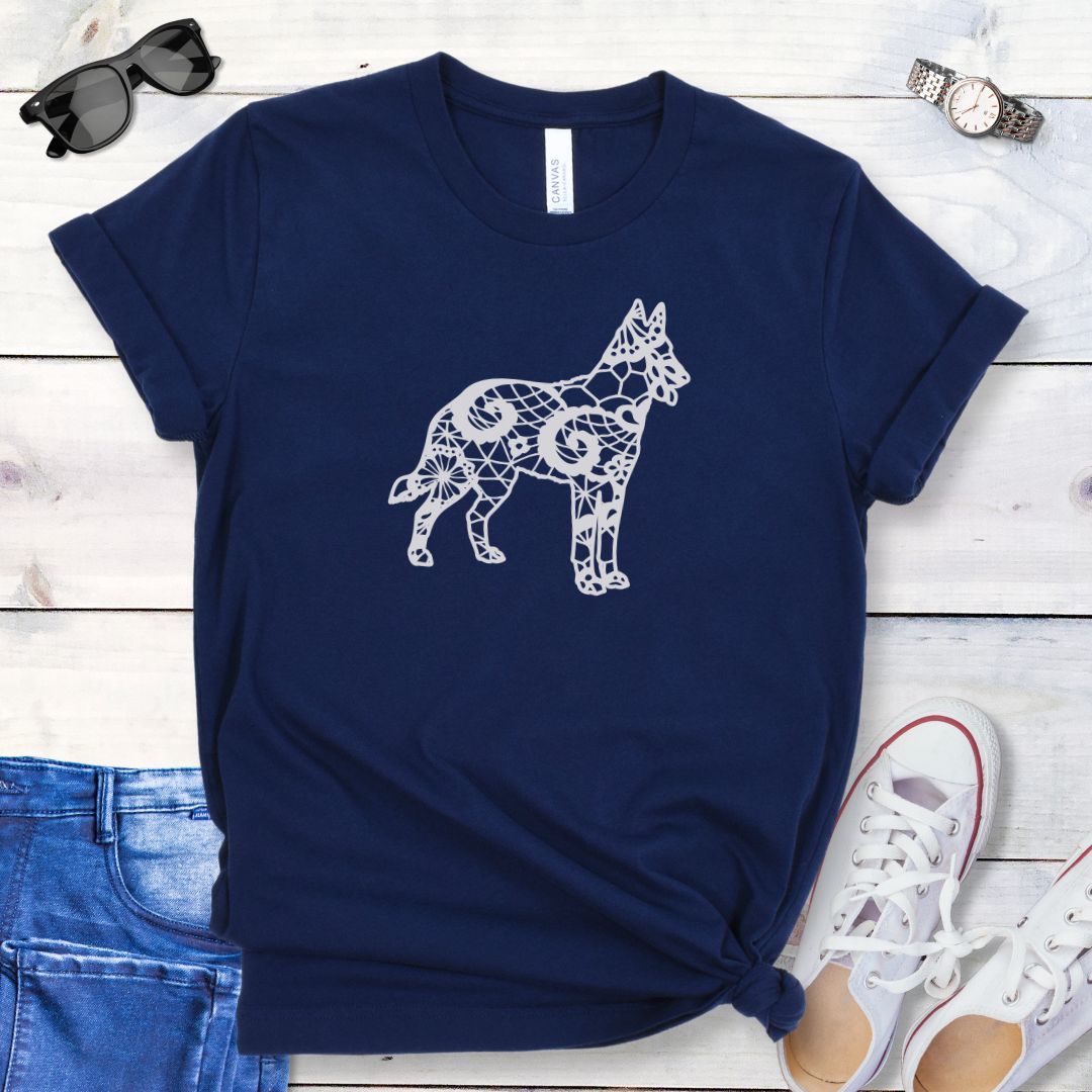 Navy blue dog mom t-shirt with a faux lace design of a Belgian Malinois dog, presented on a wooden surface with jeans and sneakers.