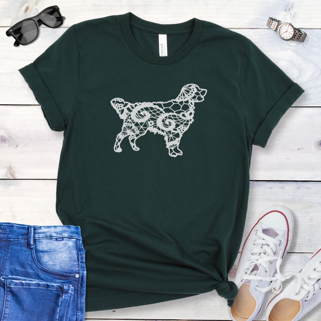 Dark green t-shirt for Golden dog moms with faux-lace design of a Golden Retriever, shown on a wooden surface with jeans and shoes.