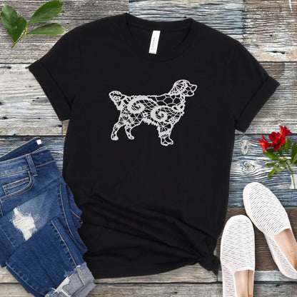 Black t-shirt for Golden dog moms with faux-lace design of a Golden Retriever, shown on a wooden surface with jeans and shoes.