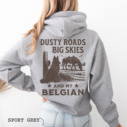 Back view of medium gray hoodie featuring a Western-style design with grazing horse, rustic fence, and a Belgian Sheepdog illustration; text reads “Dusty Roads, Big Skies, and My Belgian.”