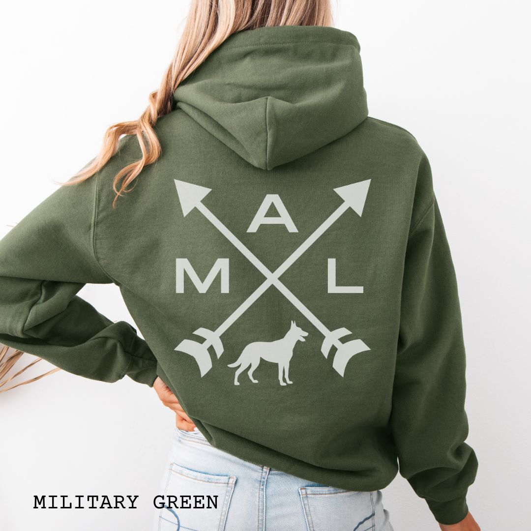 Back view of a military green unisex hoodie with a graphic of crossed arrows, a Belgian Malinois dog, and the text 'MAL', worn by a person.