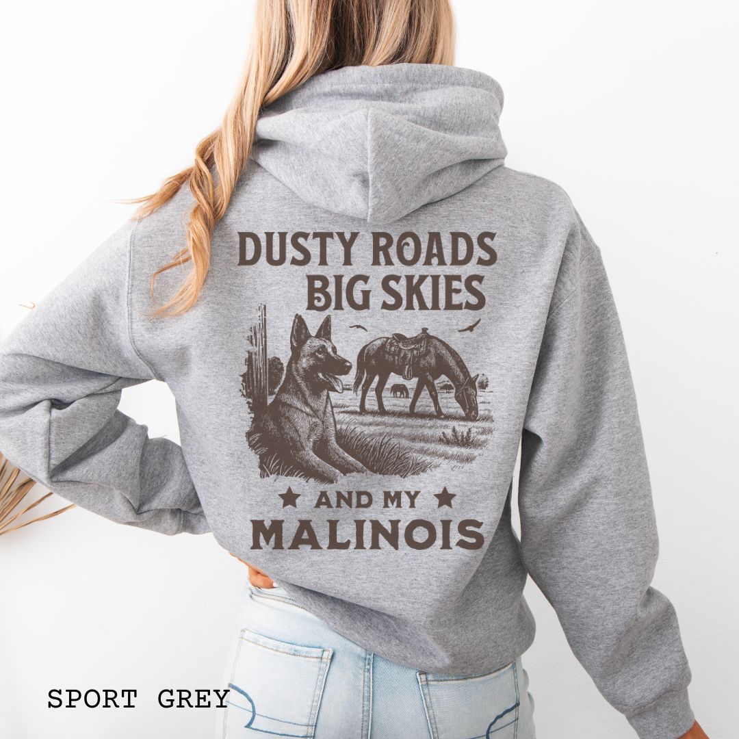 Back view of a grey Belgian Malinois hoodie featuring a Western-style design with grazing horse, rustic fence, and a Malinois illustration; text reads “Dusty Roads, Big Skies, and My Malinois.”