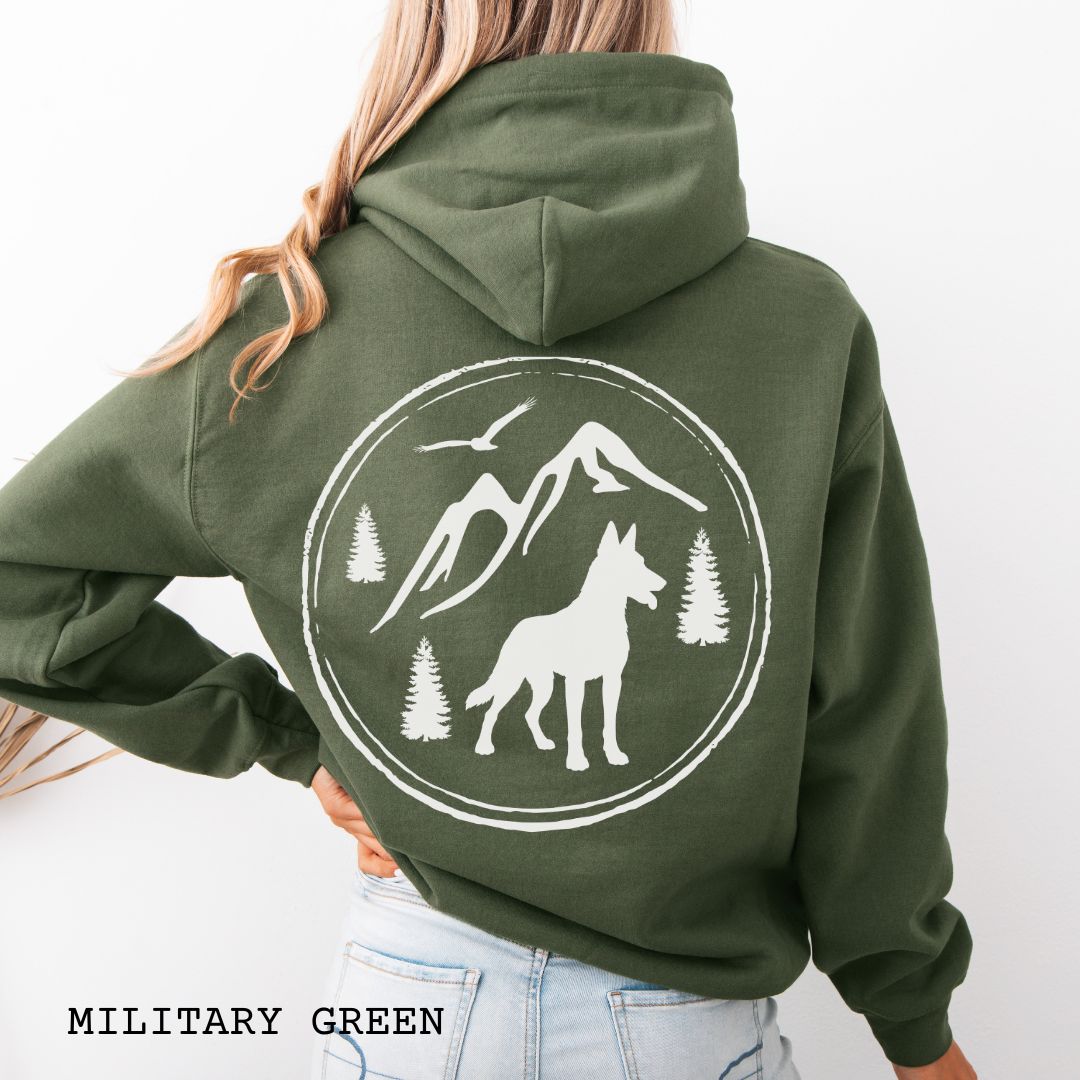 Military Green Belgian Malinois hoodie featuring a bold vintage-style back print with Malinois silhouette, mountains, pine trees, perfect gift for hiking and outdoorsy Belgian Shepherd dog lovers.