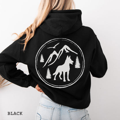 Black Belgian Malinois hoodie featuring a bold vintage-style back print with Malinois silhouette, mountains, pine trees, perfect gift for hiking and outdoorsy Belgian Shepherd dog lovers.