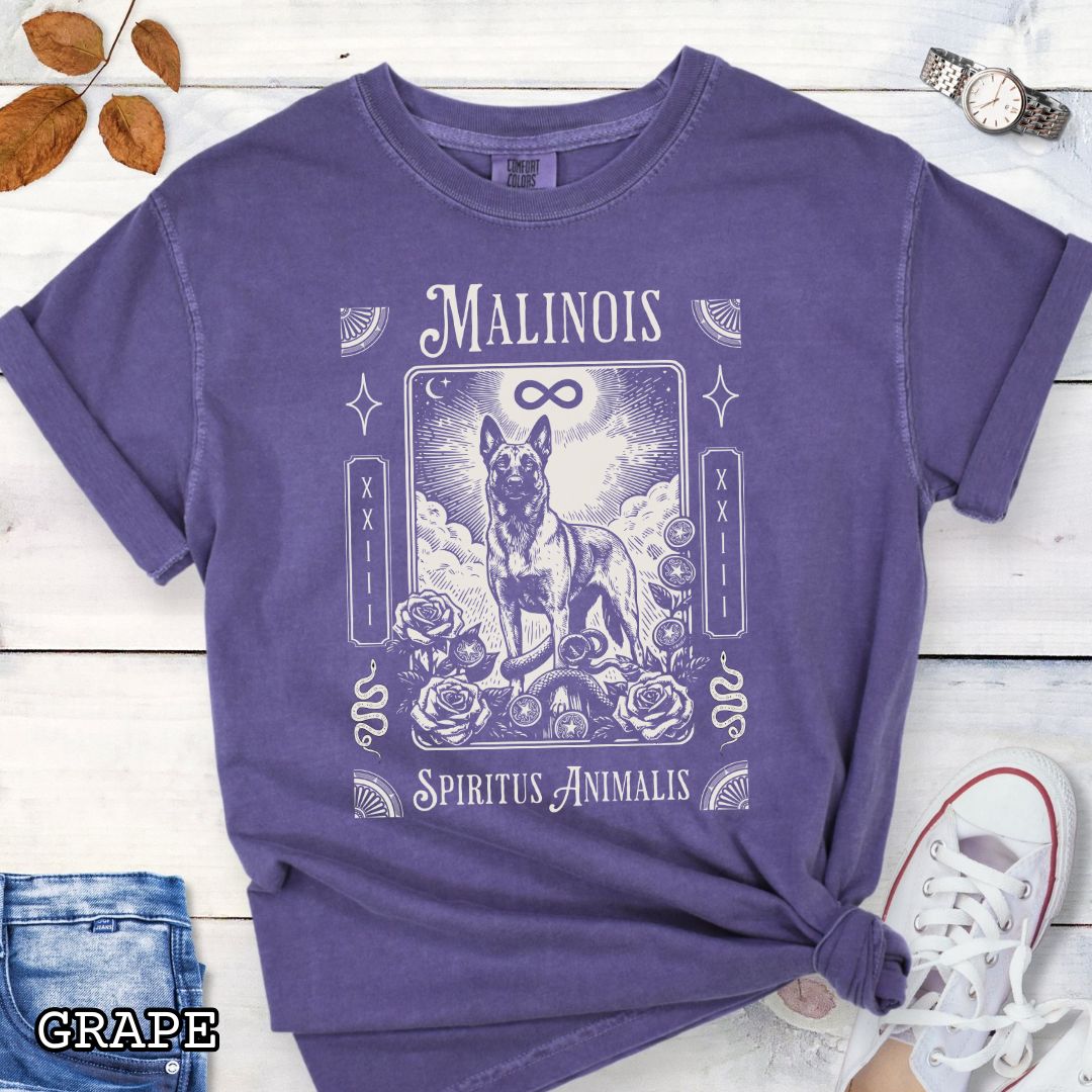 Purple Comfort Colors t-shirt featuring a Belgian Malinois tarot card design with Gothic roses and mystical symbols,  and the text 'MALINOIS' and 'SPIRITUS ANIMALIS', perfect for dog lovers and dark aesthetic Malinois fans.