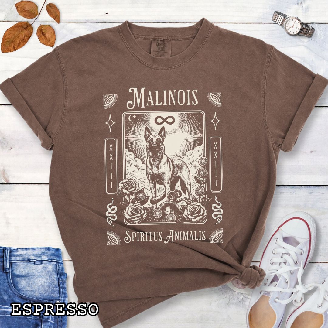 Brown Comfort Colors t-shirt featuring a Belgian Malinois tarot card design with Gothic roses and mystical symbols,  and the text 'MALINOIS' and 'SPIRITUS ANIMALIS', perfect for dog lovers and dark aesthetic Malinois fans.