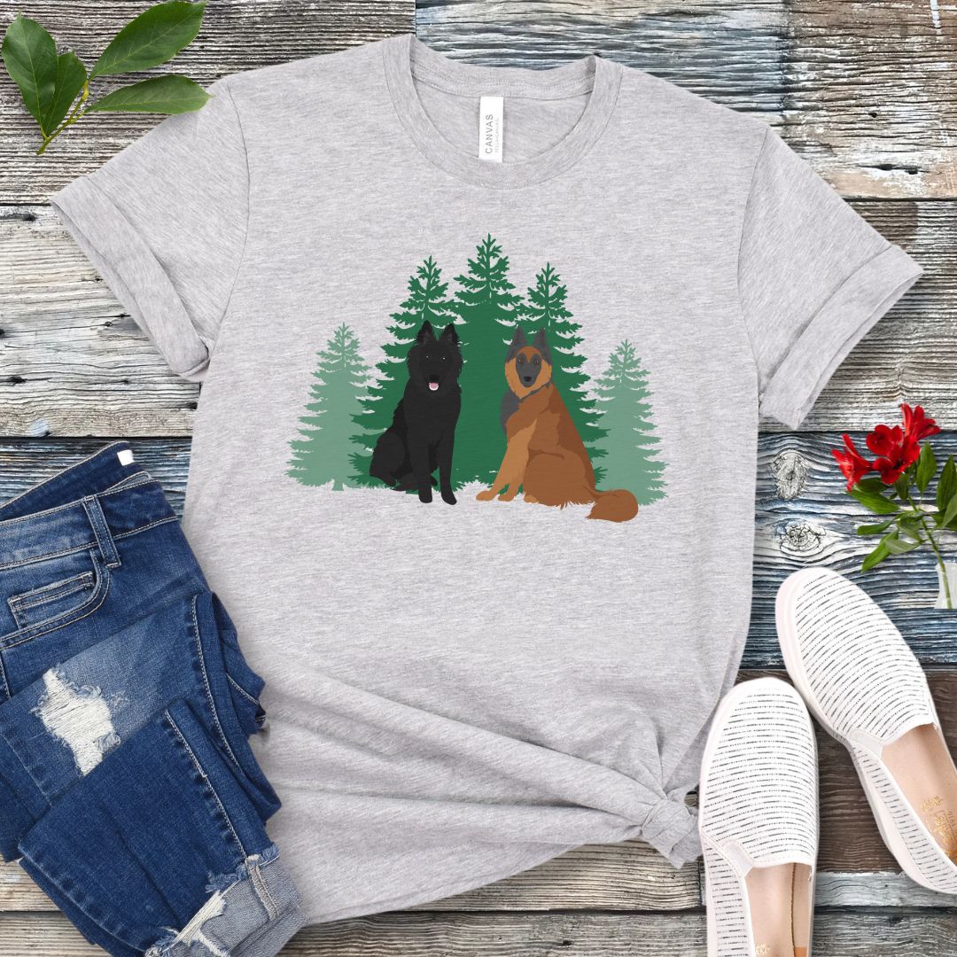 Gray Belgian Shepherd t-shirt with Belgian Sheepdog and Tervuren sitting in front of evergreen trees, shown on a wooden surface with jeans and shoes.