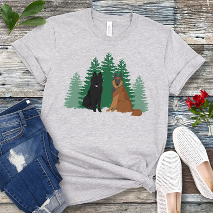 Gray Belgian Shepherd t-shirt with Belgian Sheepdog and Tervuren sitting in front of evergreen trees, shown on a wooden surface with jeans and shoes.