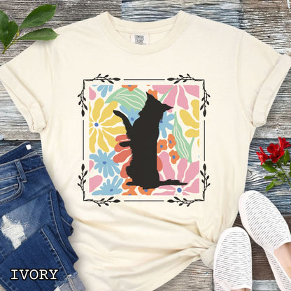 Beige Comfort Colors t-shirt with a Border Collie silhouette framed by colorful, Boho-style flowers and foliage. Displayed with jeans and a flower.