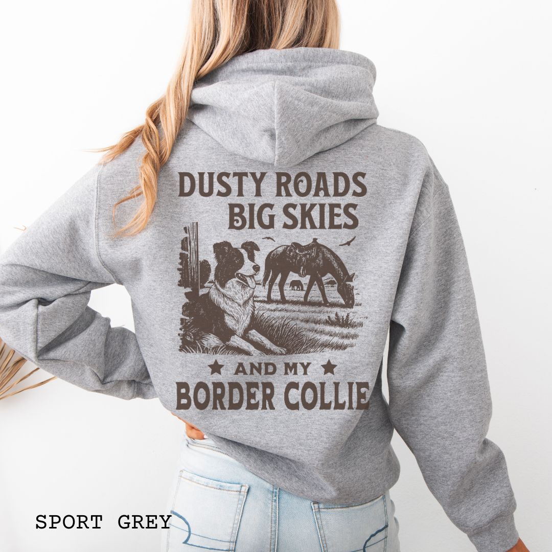 Back view of grey Border Collie hoodie featuring a Western-style design with grazing horse, rustic fence, and an Border Collie illustration; text reads “Dusty Roads, Big Skies, and My Border Collie.”
