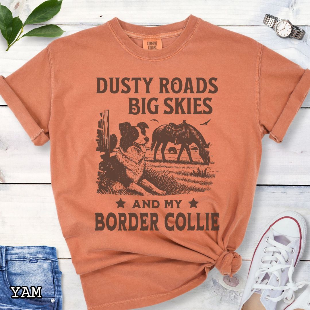 Yam-orange Comfort Colors Border Collie t-shirt featuring a Western-style design with grazing horse, rustic fence, and an Border Collie illustration; text reads “Dusty Roads, Big Skies, and My Border Collie.”