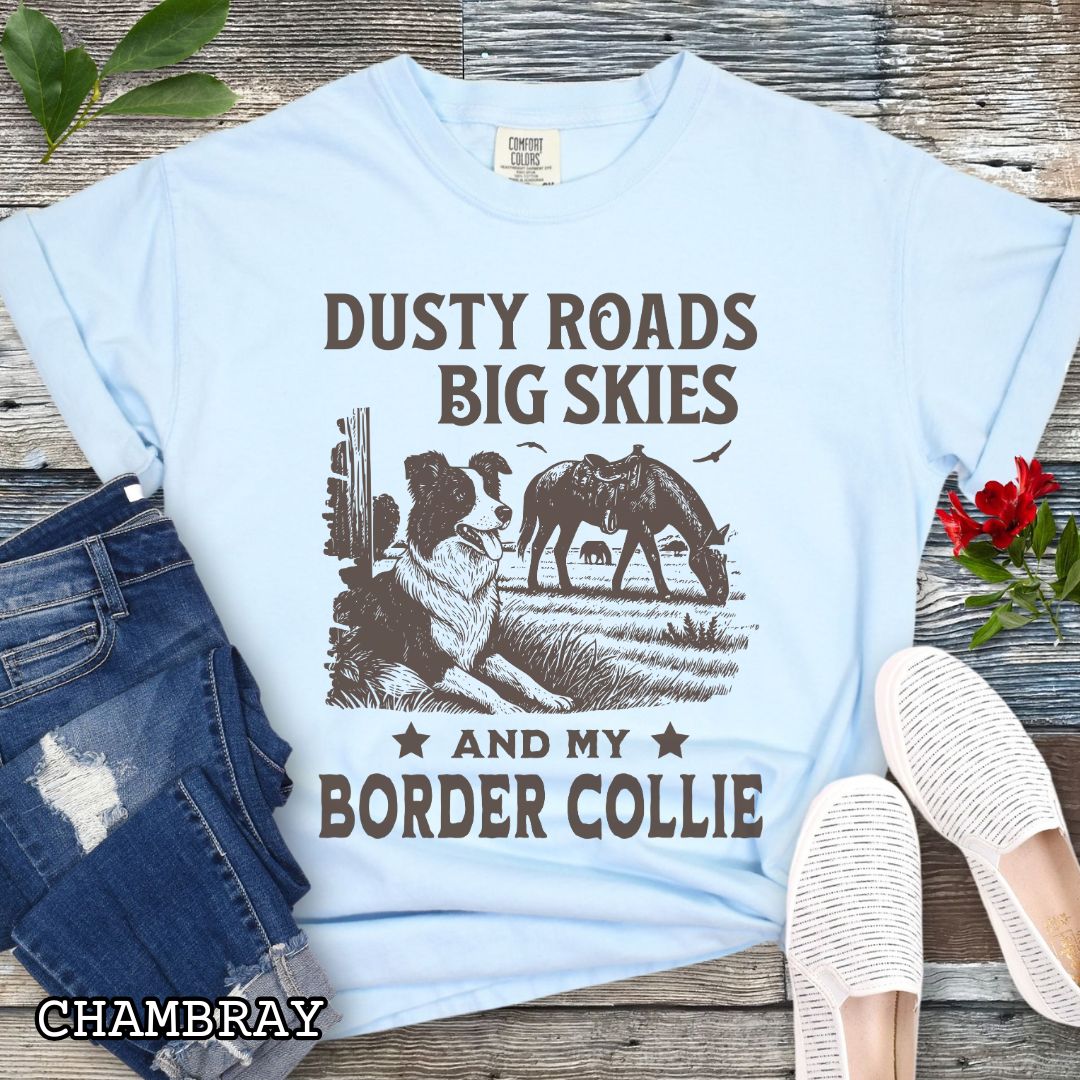 Light blue Comfort Colors Border Collie t-shirt featuring a Western-style design with grazing horse, rustic fence, and an Border Collie illustration; text reads “Dusty Roads, Big Skies, and My Border Collie.”