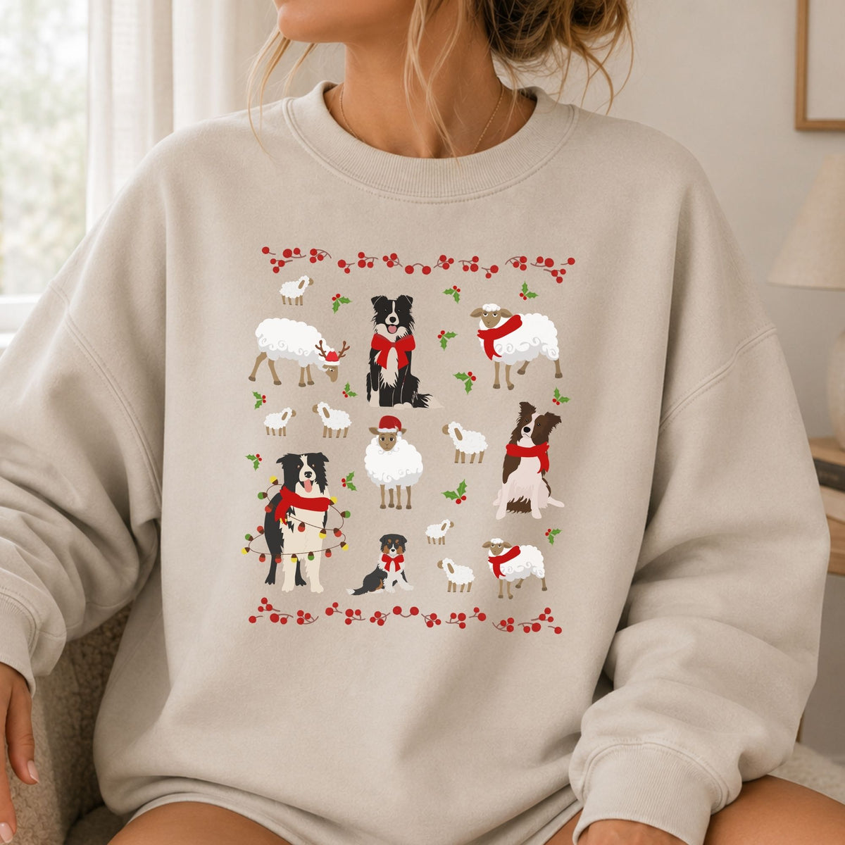 Person wearing sand Gildan 18000 Border Collies and Sheep Christmas sweatshirt featuring festive sheep, Border Collies, Santa hats, scarves, and holly for herding dog lovers.