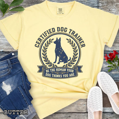Yellow Comfort Colors t-shirt featuring a Certified Dog Trainer design with dog silhouette and Be the Human Your Dog Thinks You Are message, professional dog trainer shirt for canine trainers, obedience instructors, and dog training professionals.