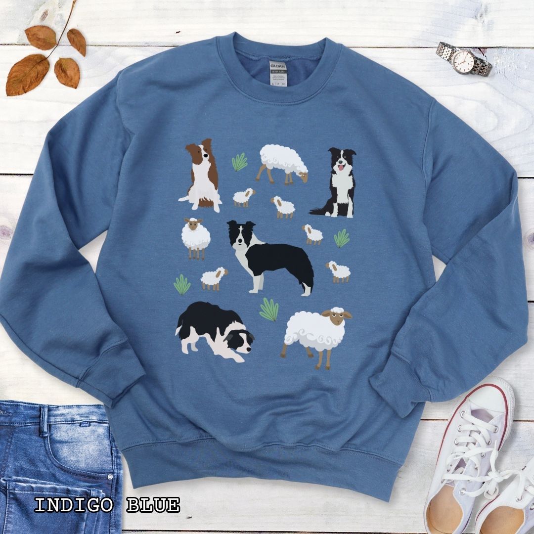 Blue unisex sweatshirt with cottagecore Border Collies and Sheep design featuring playful Border Collie herding dogs, fluffy sheep, and countryside artwork for sheepdog handlers, herding dog trainers, and Border Collie lovers.