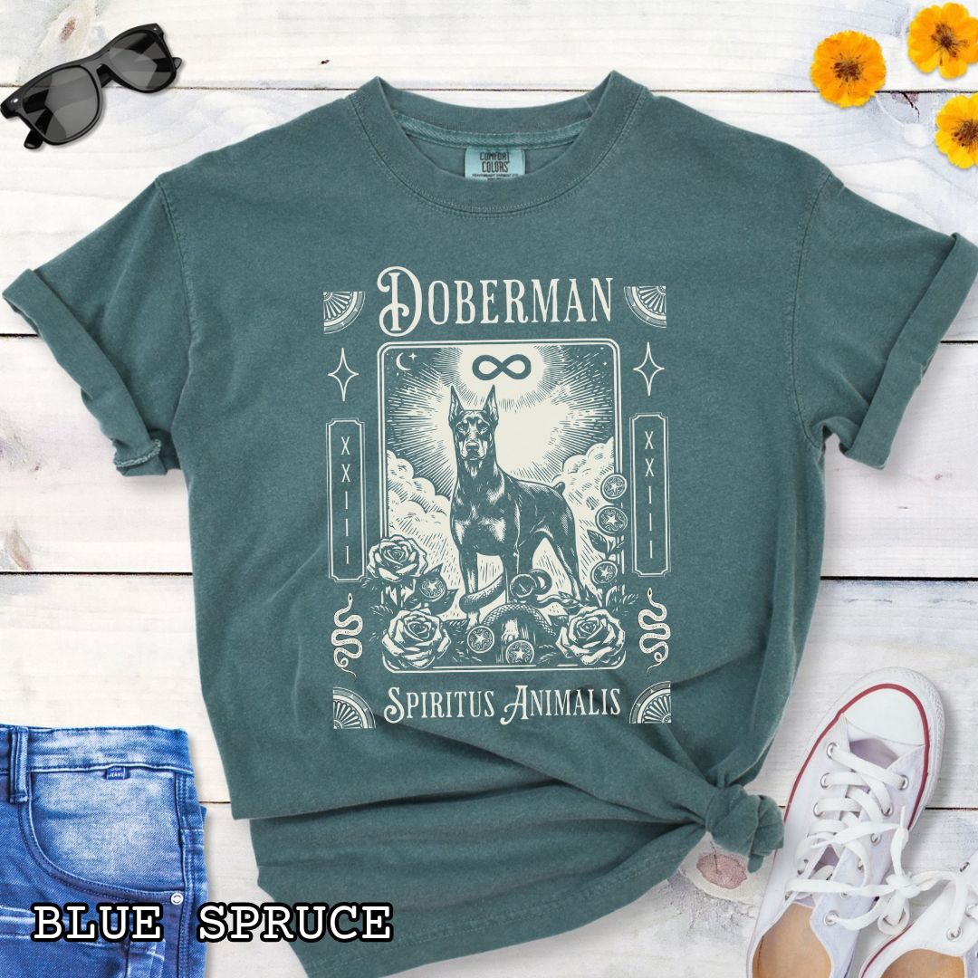 Green Comfort Colors t-shirt featuring a Doberman Pinscher tarot card design with Gothic roses and mystical symbols, perfect for Goth dog lovers and dark aesthetic Doberman fans.