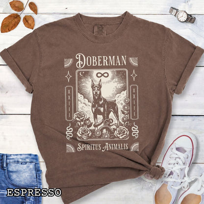 Brown Comfort Colors t-shirt featuring a Doberman Pinscher tarot card design with Gothic roses and mystical symbols, perfect for Goth dog lovers and dark aesthetic Doberman fans.