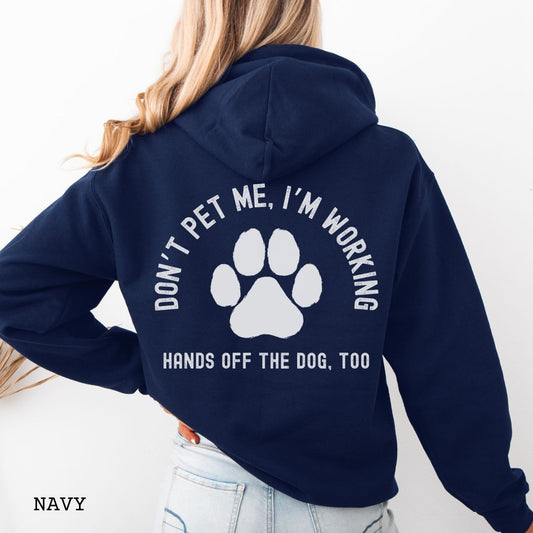 Navy back print hoodie with the text 'DON'T PET ME, I'M WORKING, HANDS OFF THE DOG, TOO' and a paw print design.
