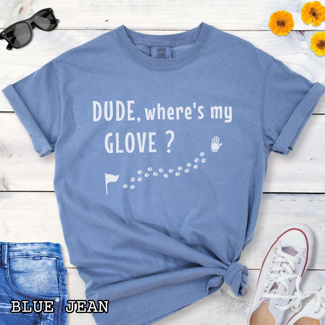 Blue tracking dog t-shirt with flag, paw prints, and glove, and the text 'DUDE, where's my GLOVE?', presented on a wooden surface with accessories.