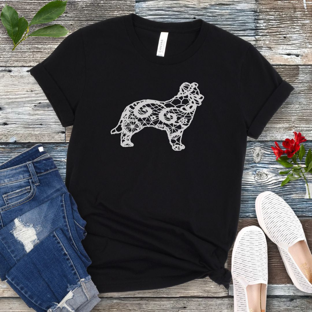Black t-shirt for Border Collie moms with lace-pattern filled Border Collie silhouette, shown on a wooden surface with accessories.