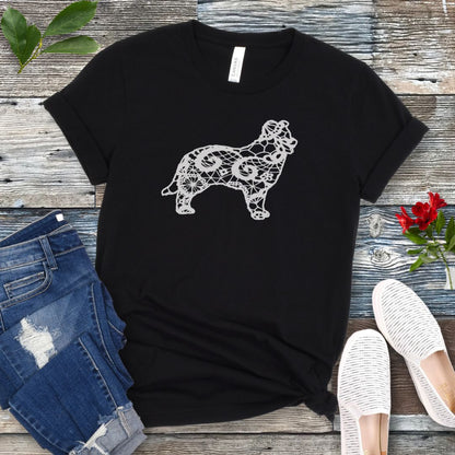 Black t-shirt for Border Collie moms with lace-pattern filled Border Collie silhouette, shown on a wooden surface with accessories.