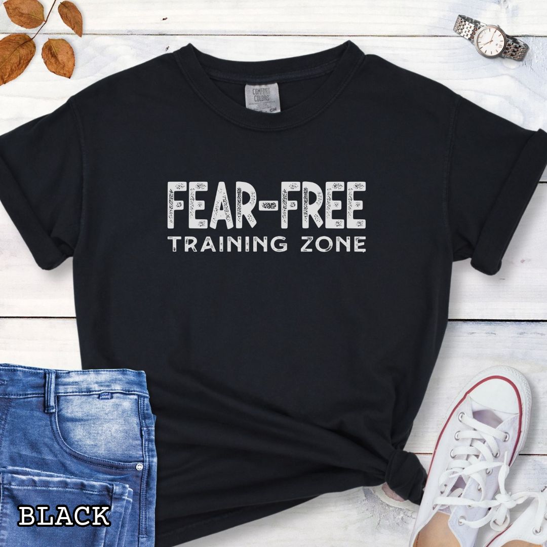 Black Comfort Colors Fear-Free Dog Training Zone t-shirt featuring bold distressed typography for positive reinforcement dog trainers, behavior professionals, and reward-based training enthusiasts.