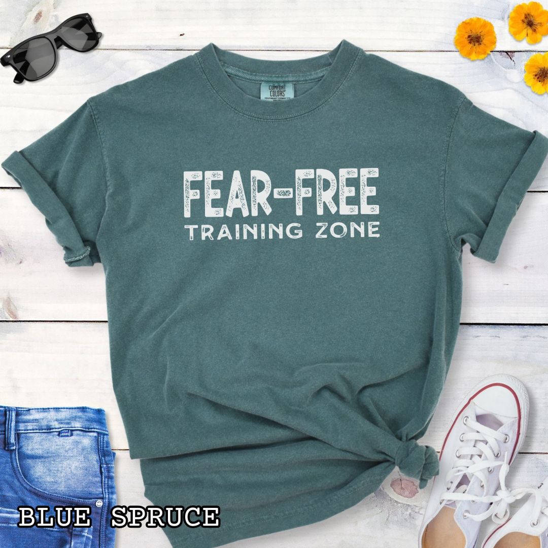 Green Comfort Colors Fear-Free Dog Training Zone t-shirt featuring bold distressed typography for positive reinforcement dog trainers, behavior professionals, and reward-based training enthusiasts.