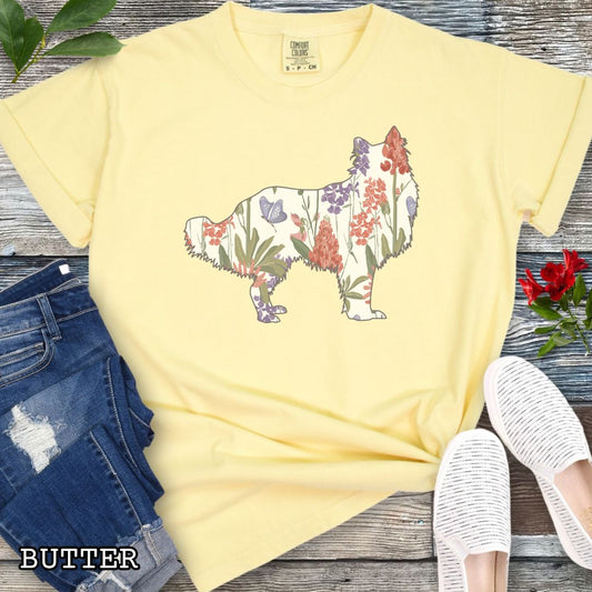Yellow Comfort Colors t-shirt with Rough Collie silhouette filled with floral pattern, presented on a wooden surface with jeans and shoes.
