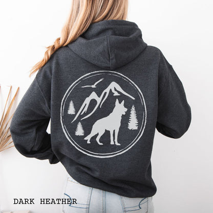 Dark grey Gildan 18500 German Shepherd Mountain Adventure hoodie featuring a large vintage-style back print with GSD silhouette, mountains, pine trees, and birds for hiking and outdoor dog lovers.
