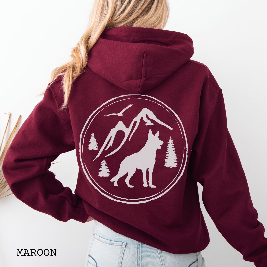 Maroon Gildan 18500 German Shepherd Mountain Adventure hoodie featuring a large vintage-style back print with GSD silhouette, mountains, pine trees, and birds for hiking and outdoor dog lovers.