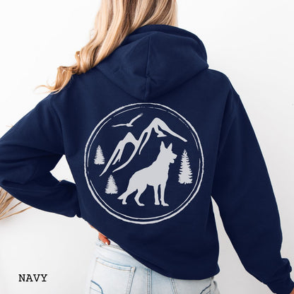Navy blue Gildan 18500 German Shepherd Mountain Adventure hoodie featuring a large vintage-style back print with GSD silhouette, mountains, pine trees, and birds for hiking and outdoor dog lovers.