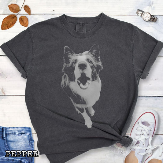 Dark gray Comfort Colors t-shirt with a vintage style monochrome Border Collie dog photo in grunge, streetwear style. Shown on a wooden surface with shoes and jeans.