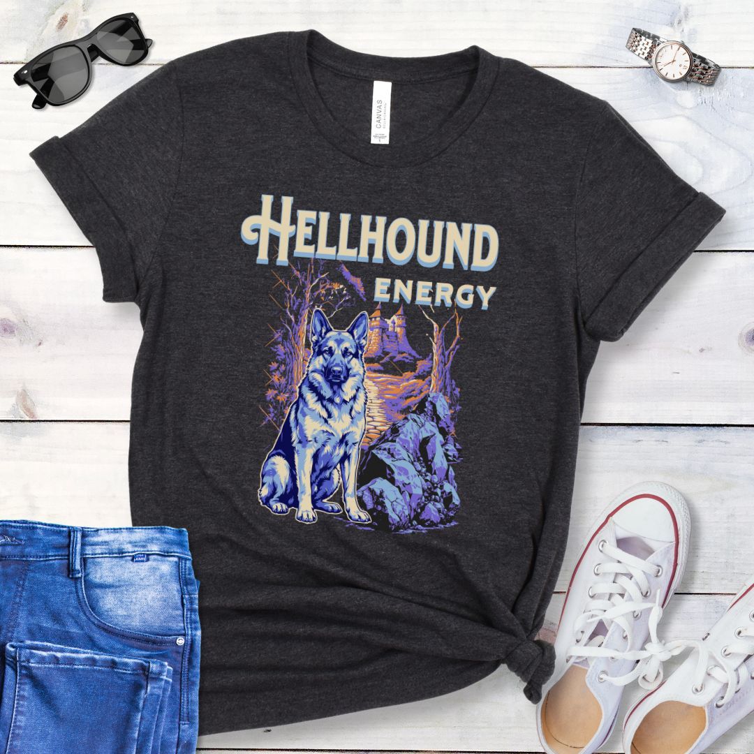 Dark grey Bella Canvas t-shirt featuring a goth-style German Shepherd design with haunted landscape, castle and German Shepherd Dog, and the text Hellhound Energy in retro lettering, perfect for GSD lovers, Halloween dog moms, and spooky dog enthusiasts.
