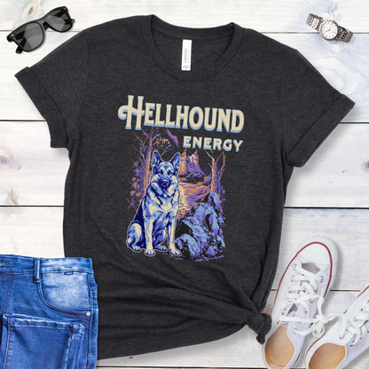 Dark grey Bella Canvas t-shirt featuring a goth-style German Shepherd design with haunted landscape, castle and German Shepherd Dog, and the text Hellhound Energy in retro lettering, perfect for GSD lovers, Halloween dog moms, and spooky dog enthusiasts.