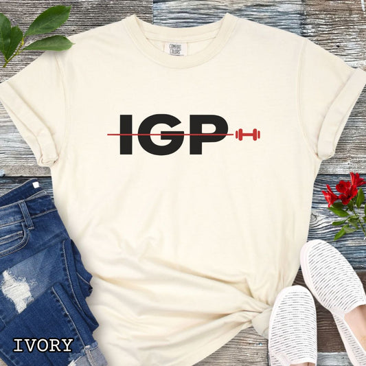 Ivory Comfort Colors t-shirt featuring a bold IGP dumbbell design, perfect for IGP dog sport, Schutzhund, IPO, and working dog training enthusiasts.
