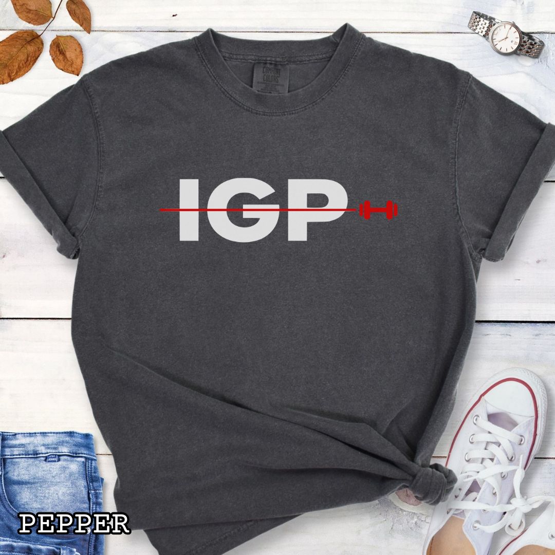 Dark grey Comfort Colors t-shirt featuring a bold IGP dumbbell design, perfect for IGP dog sport, Schutzhund, IPO, and working dog training enthusiasts.