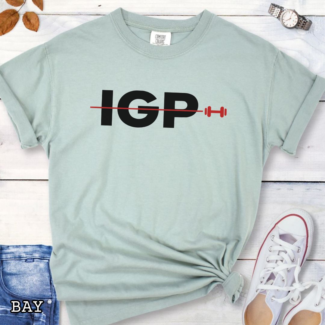 Light green Comfort Colors t-shirt featuring a bold IGP dumbbell design, perfect for IGP dog sport, Schutzhund, IPO, and working dog training enthusiasts.