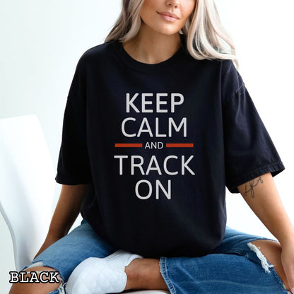 Woman wearing a black dog tracking training t-shirt with 'Keep Calm and Track On' in bold text.
