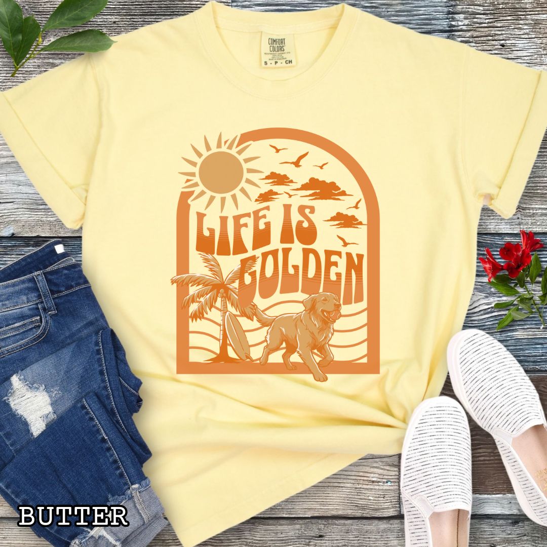 Yellow Comfort Colors Golden Retriever t-shirt featuring retro tropical sunset design with palm trees, surfboard, and Life Is Golden slogan, perfect for Golden Retriever lovers, beach dog moms, and summer dog lover gifts.