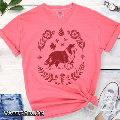 Watermelon pink Comfort Colors t-shirt with folk art style Rough Collie t-shirt featuring a linocut-inspired collie surrounded by floral and botanical elements in a boho cottagecore design. Perfect dog lover gift for Collie owners.