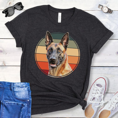 Dark grey t-shirt for Belgian Malinois lovers with a vintage sunset graphic and Malinois face, shown on a wooden surface with jeans and shoes.