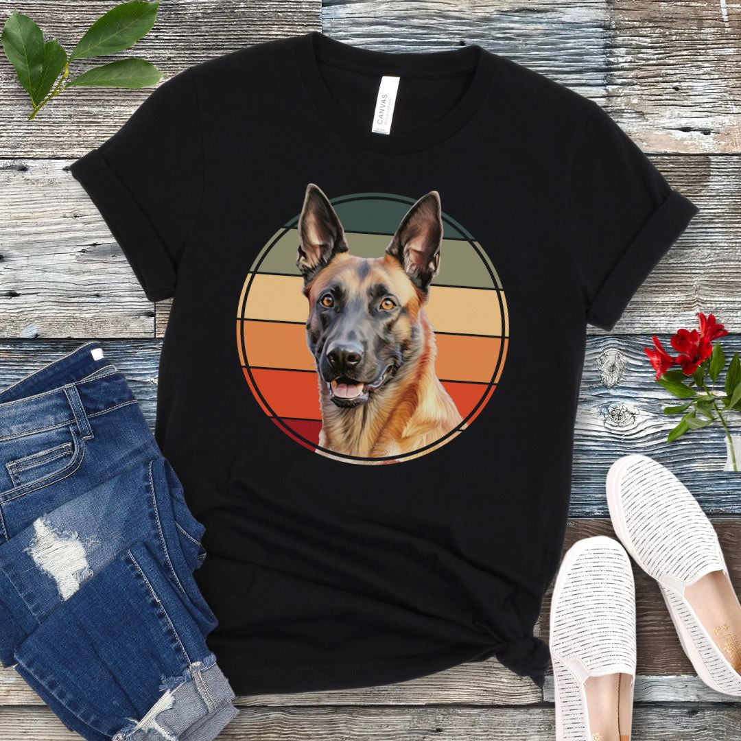 Black t-shirt for Belgian Malinois lovers with a vintage sunset graphic and Malinois face, shown on a wooden surface with jeans and shoes.