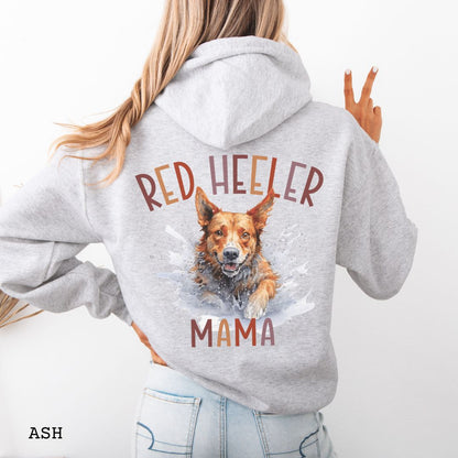 Person wearing a gray Australian Cattle Dog hoodie with 'Red Heeler Mama' text and a Heeler dog watercolor illustration on the back.