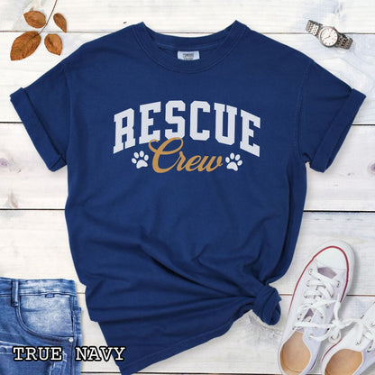 Navy Comfort Colors t-shirt featuring bold college-style Rescue Crew text with paw prints, perfect for rescue dog lovers, dog adoption advocates, fosters, and rescue volunteers.