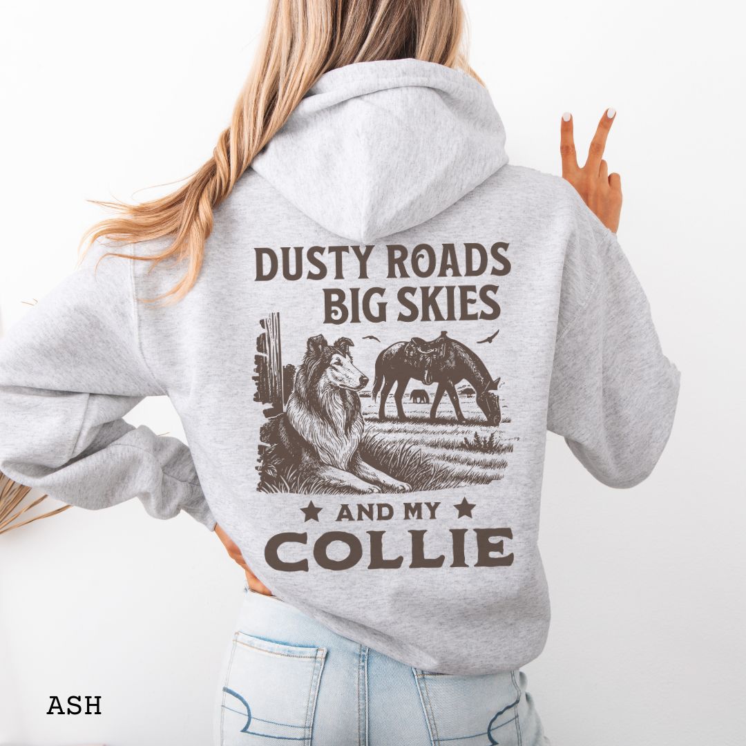 Back view of an ash-grey Collie hoodie featuring a Western-style design with grazing horse, rustic fence, and a Rough Collie illustration; text reads “Dusty Roads, Big Skies, and My Collie.”