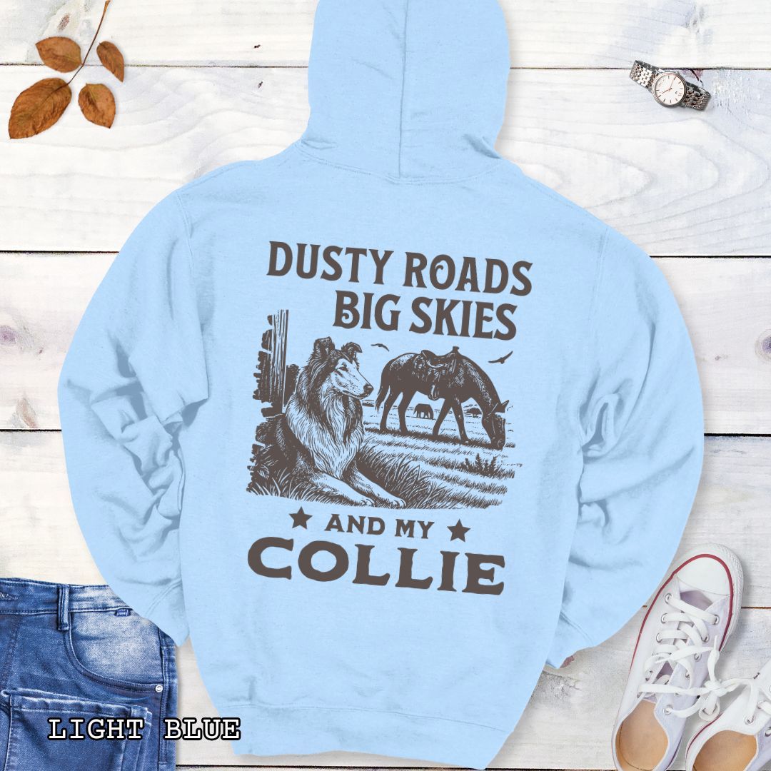 Back view of an light blue Collie hoodie featuring a Western-style design with grazing horse, rustic fence, and a Rough Collie illustration; text reads “Dusty Roads, Big Skies, and My Collie.”