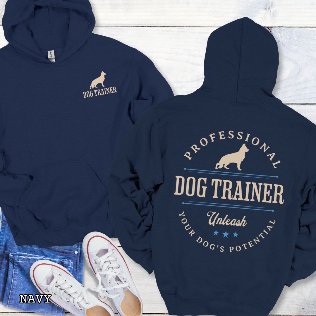 Front and back view of a navy dog training hoodie with the text 'PROFESSIONAL DOG TRAINER, Unleash Your Dog's Potential"' and custom dog breed silhouette in a vintage, badge style design. The shirt is displayed flat with a pair of blue jeans and white shoes.